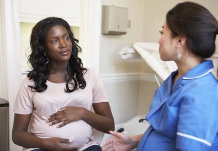 Pregnant Woman with Doctor